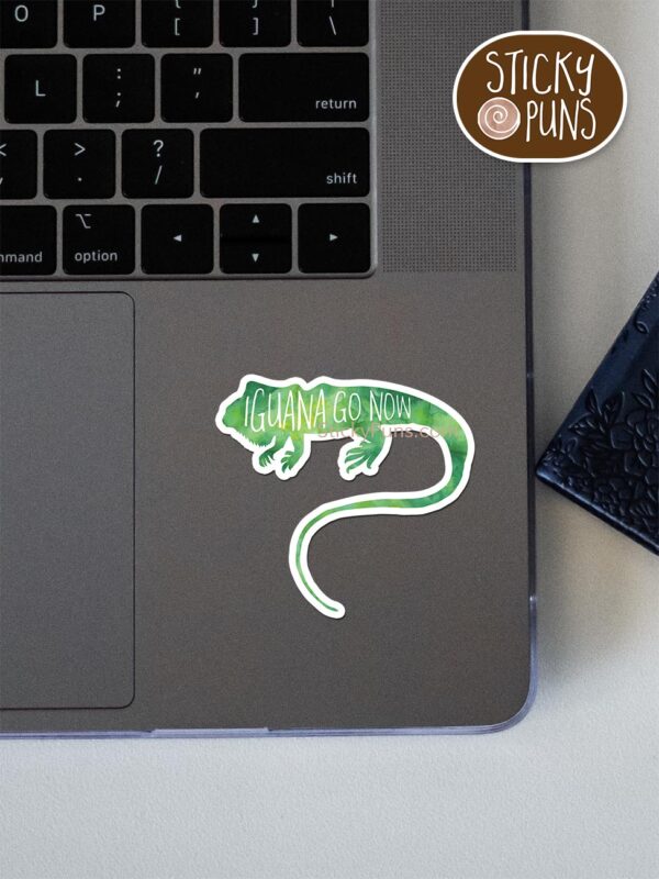 IGUANA go now - funny iguana pun sticker shown stuck on a laptop