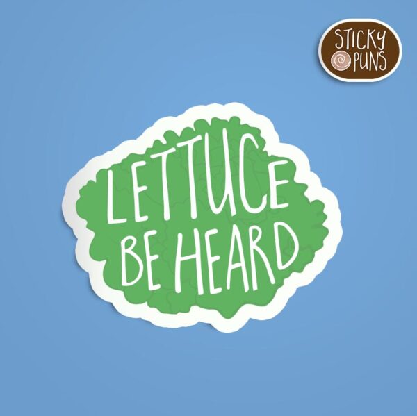 Lettuce pun sticker with the phrase “Lettuce Be Heard” in bold text.